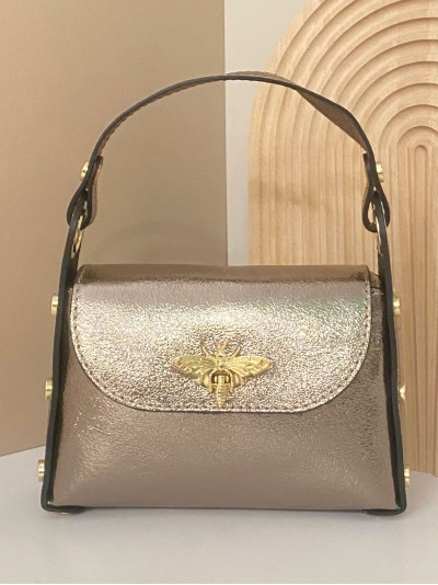 Mini bolso de mano piel tachas cobre