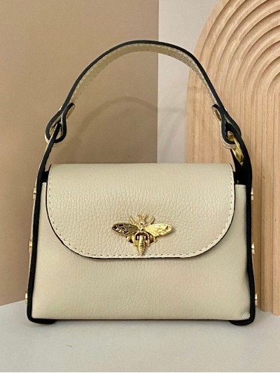 Mini bolso de mano piel tachas beige