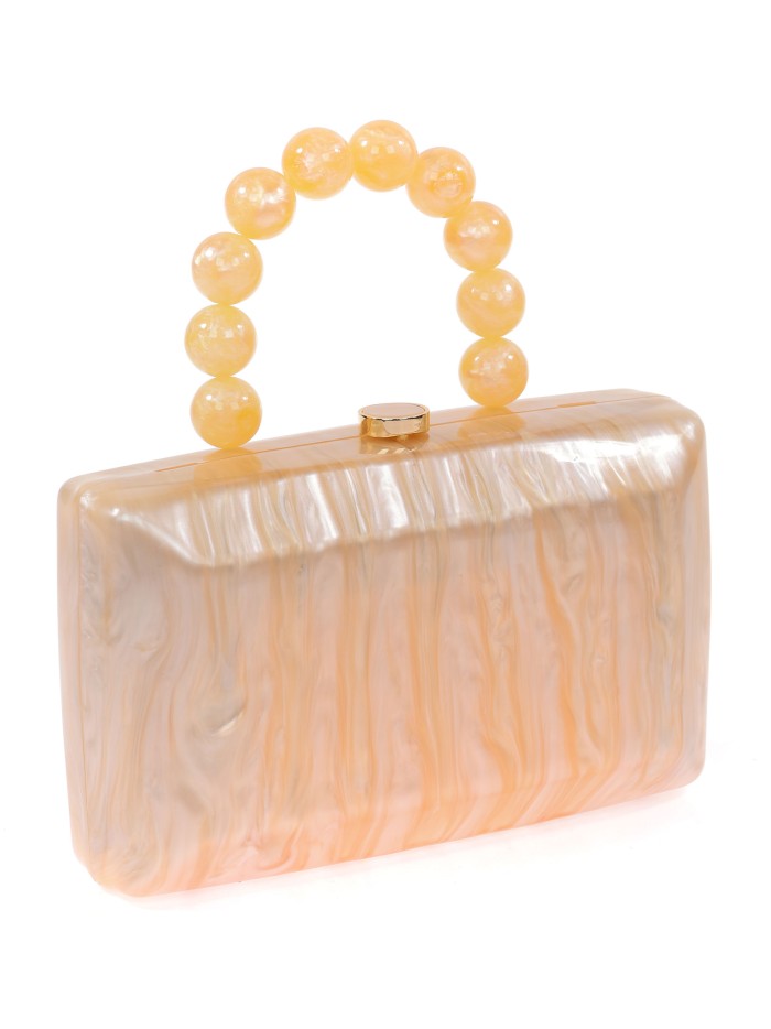 Bolso clutch de fiesta nácar detalle asa oro-claro