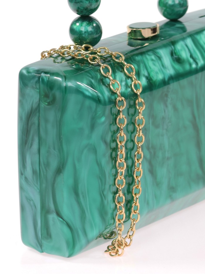 Bolso clutch de fiesta nácar detalle asa verde