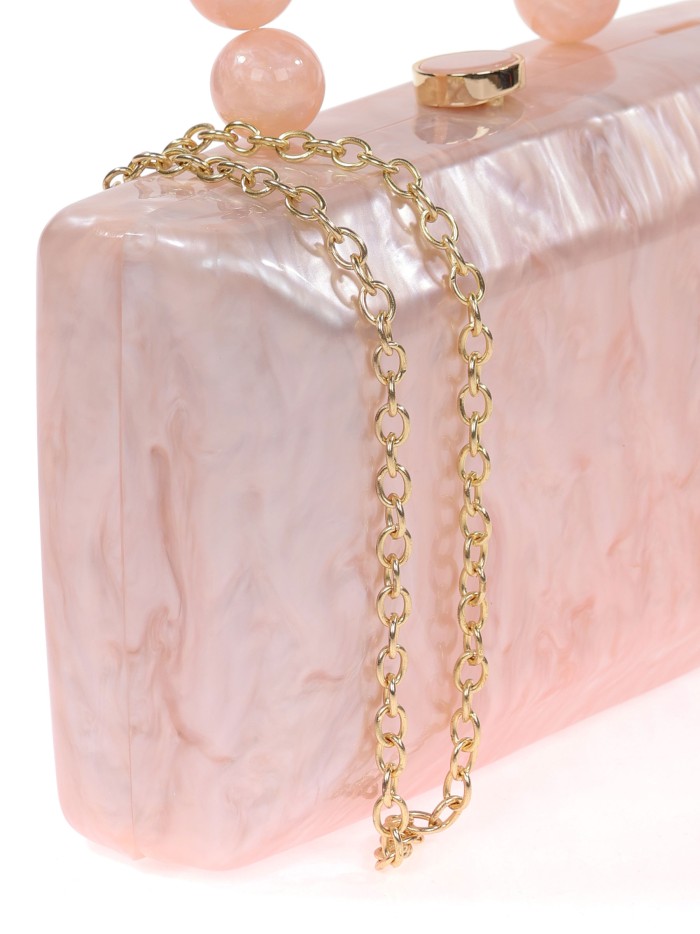 Bolso clutch de fiesta nácar detalle asa nude