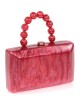 Bolso clutch de fiesta nácar detalle asa rojo