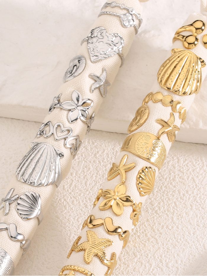 Conjunto de 12 anillos estrella de mar y conchas - Acero inoxidable