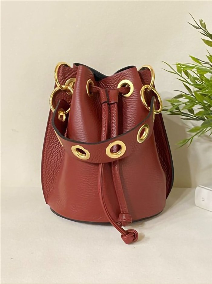 Mini Saca piel detalle metálico