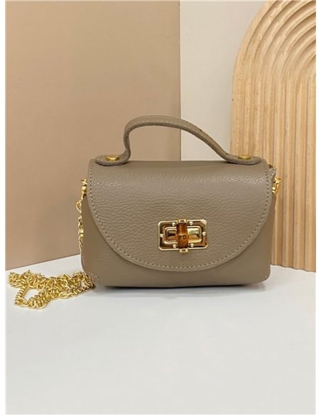 Mini bolso de mano de piel con cierre metálico