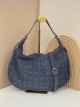 Bolso hobo piel serraje con tachas