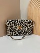 Mini bolso bandolera serraje animal print detalle metálico