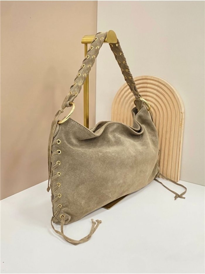 Bolso de hombro piel serraje con asa trenzada y laterales con cordones