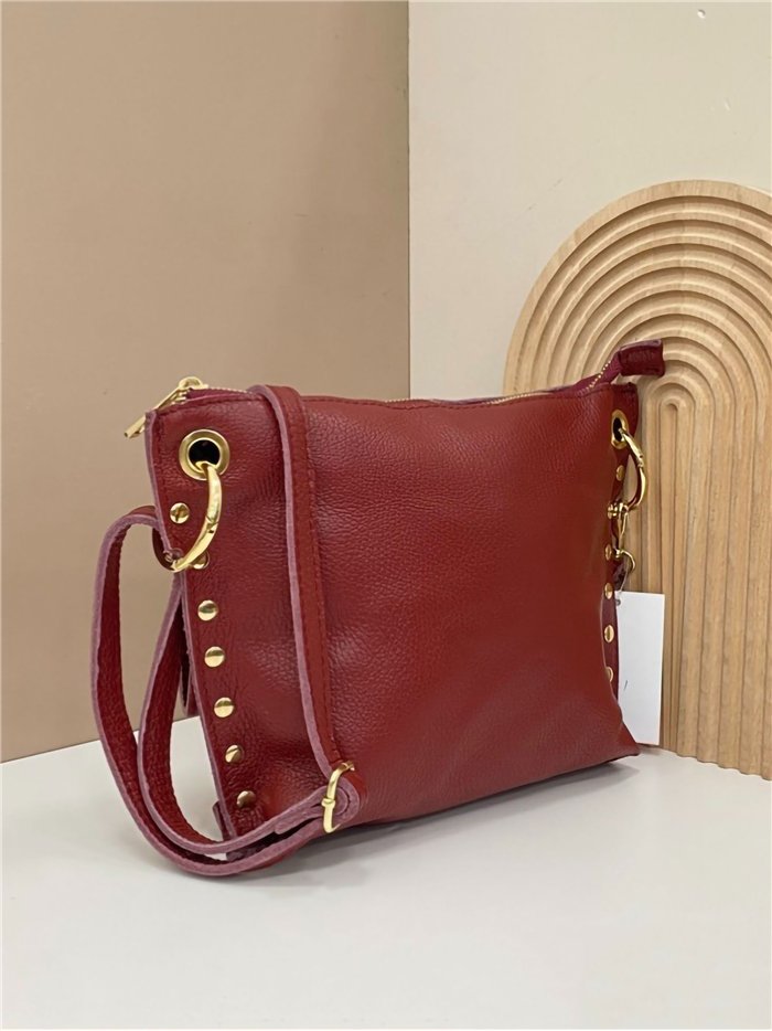 Leather crossbody bag with side studs