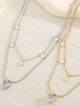 Collana doppia con pendente a cuore e zircone.