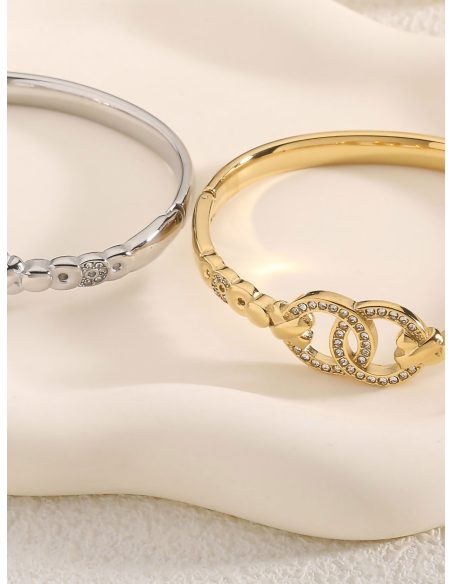 Starre Armband mit verflochtenen Ringen und Zirkonia