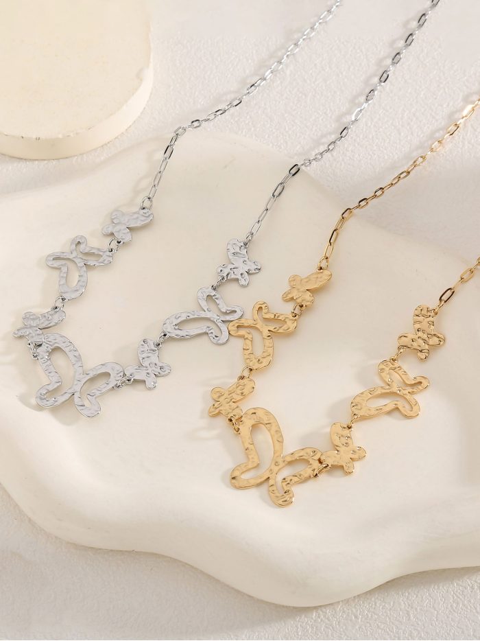 Collana pendente farfalle texture