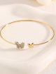 Pulsera rígida mariposa con circonitas