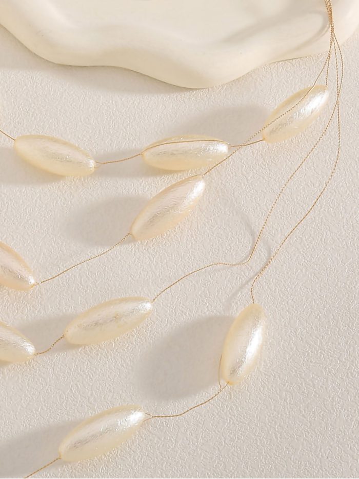 Collar multicapa con perlas