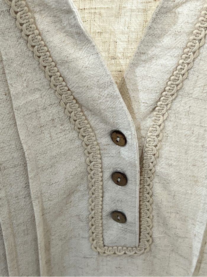 Linen blouse with lace hem