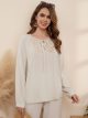 Linen blouse with tie neck and lace