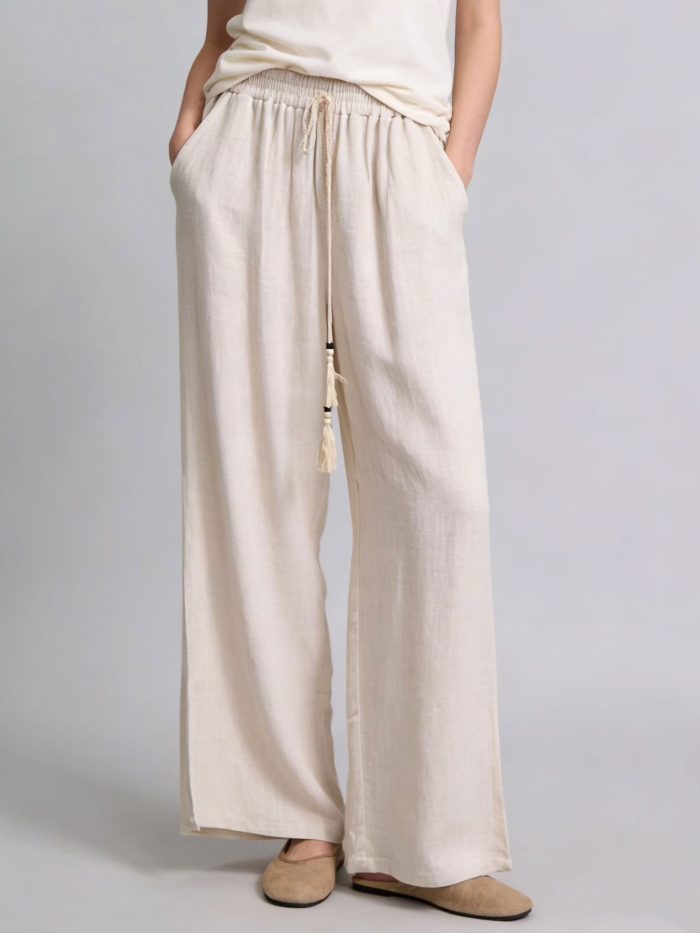 Pantaloni larghi in lino con coulisse e nappe