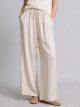 Pantaloni larghi in lino con coulisse e nappe