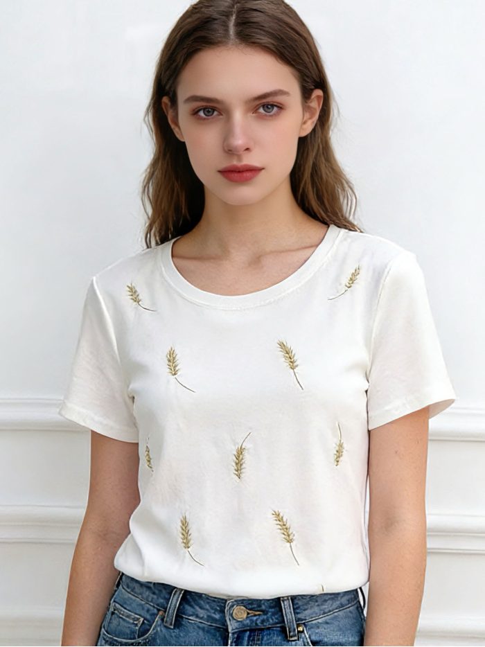 Camiseta bordada plumas