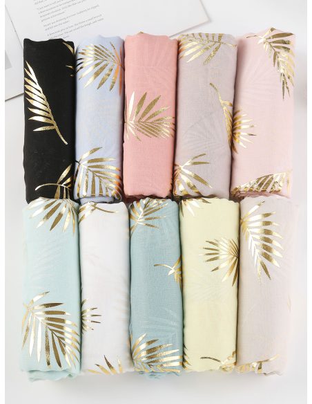 Lenço dourado em formato de folha de palmeira