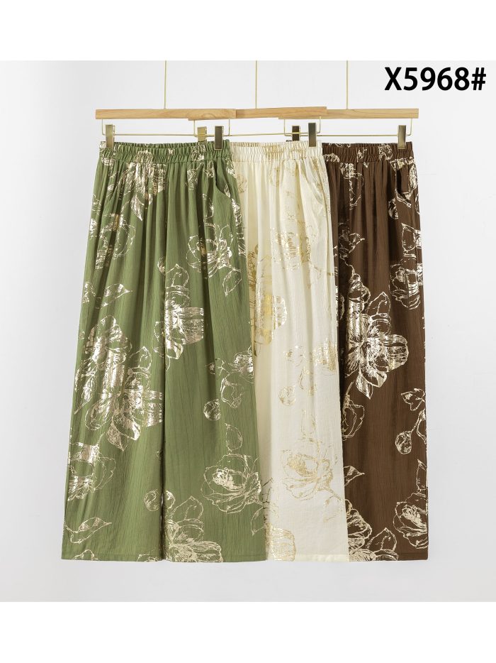 Pantaloni palazzo con fiori effetto oro