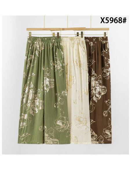 Pantaloni palazzo con fiori effetto oro