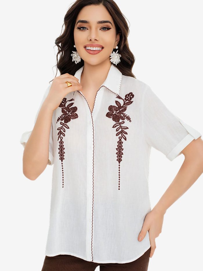 Bluse mit Blumenstickerei und kontrastierender Borte