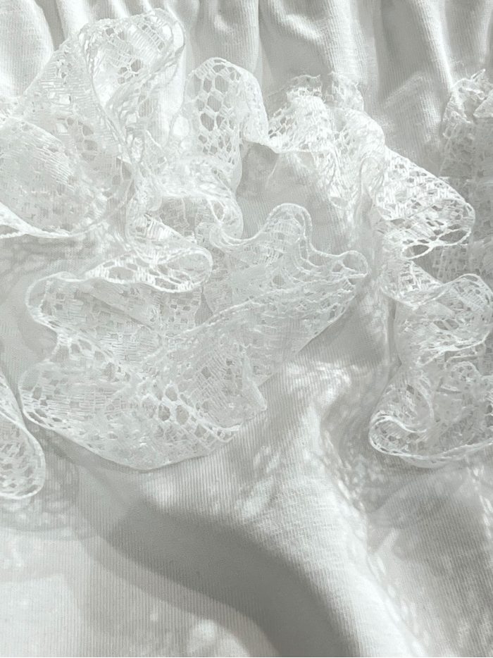 Top in pizzo con scollo Bardot