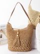 Bolso hobo de rafia con borlas