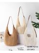 Grande borsa hobo traforata all'uncinetto con manici in similpelle