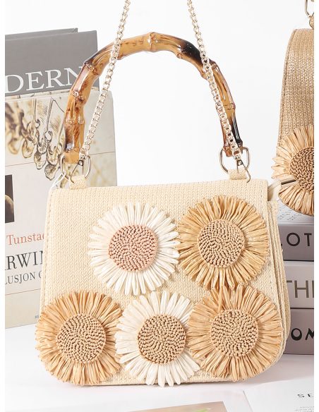 Mini bolsa de ráfia com flores e alça com efeito de bambu.