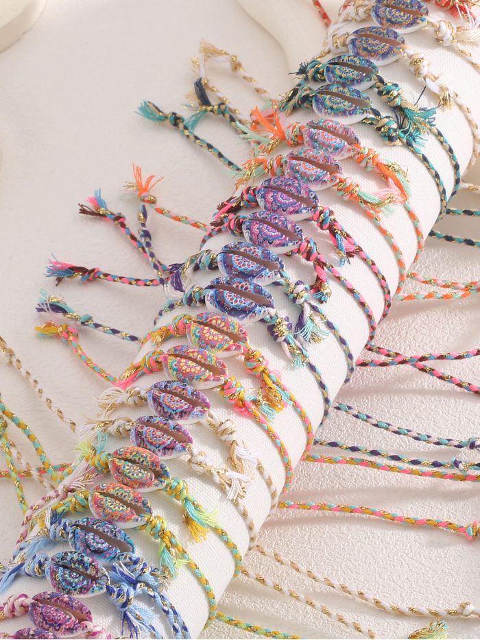 Set of 24 adjustable boho shell bracelets with display stand