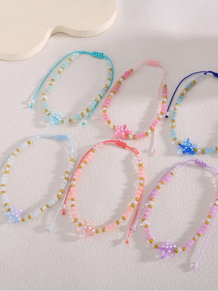 Pack 12 tobilleras ajustables estrella marina pastel