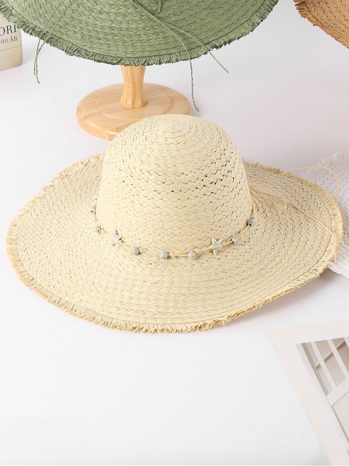 Sombrero de rafia con borde desflecado y estrella