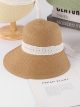 Sombrero de rafia tipo cloche con cinta bordada
