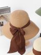 Sombrero de rafia ala ancha con lazo grande