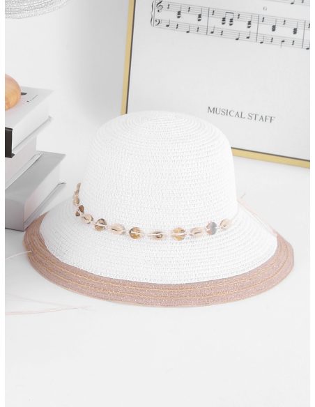 Sombrero de rafia tipo cloche con conchas y borde a contraste