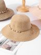 Sombrero de rafia con banda de conchas