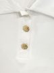 Camiseta cuello polo botones dorados
