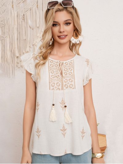 Blusa lino con bordado y lazada borlas