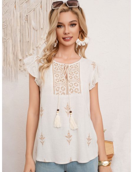 Blusa in lino con ricamo e fiocco con nappe