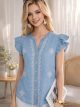 Blusa símil denim bordada botones y volantes
