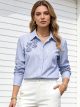 Camisa rayas con aplique floral
