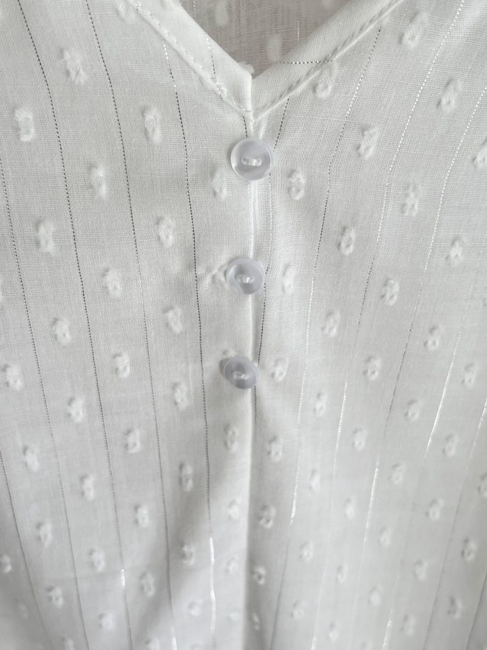 Top plumeti con lazos en hombros