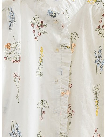 Chemisier brodé de fleurs avec volant sur le devant
