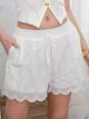 Short brodé ajouré à ourlet festonné
