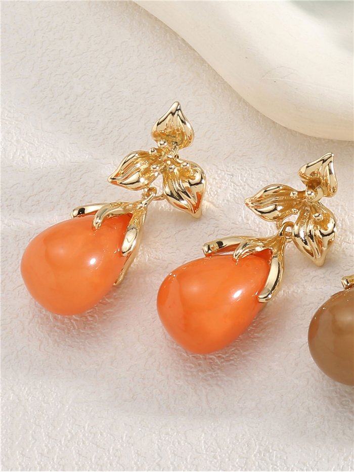 Pendientes flor dorada con gota de resina