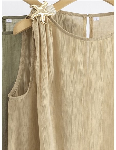 Top sin mangas con broche estrella de mar