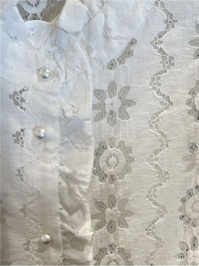 Chemisier en dentelle à volants