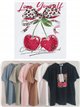 Camiseta amplia estampada cerezas y lazo